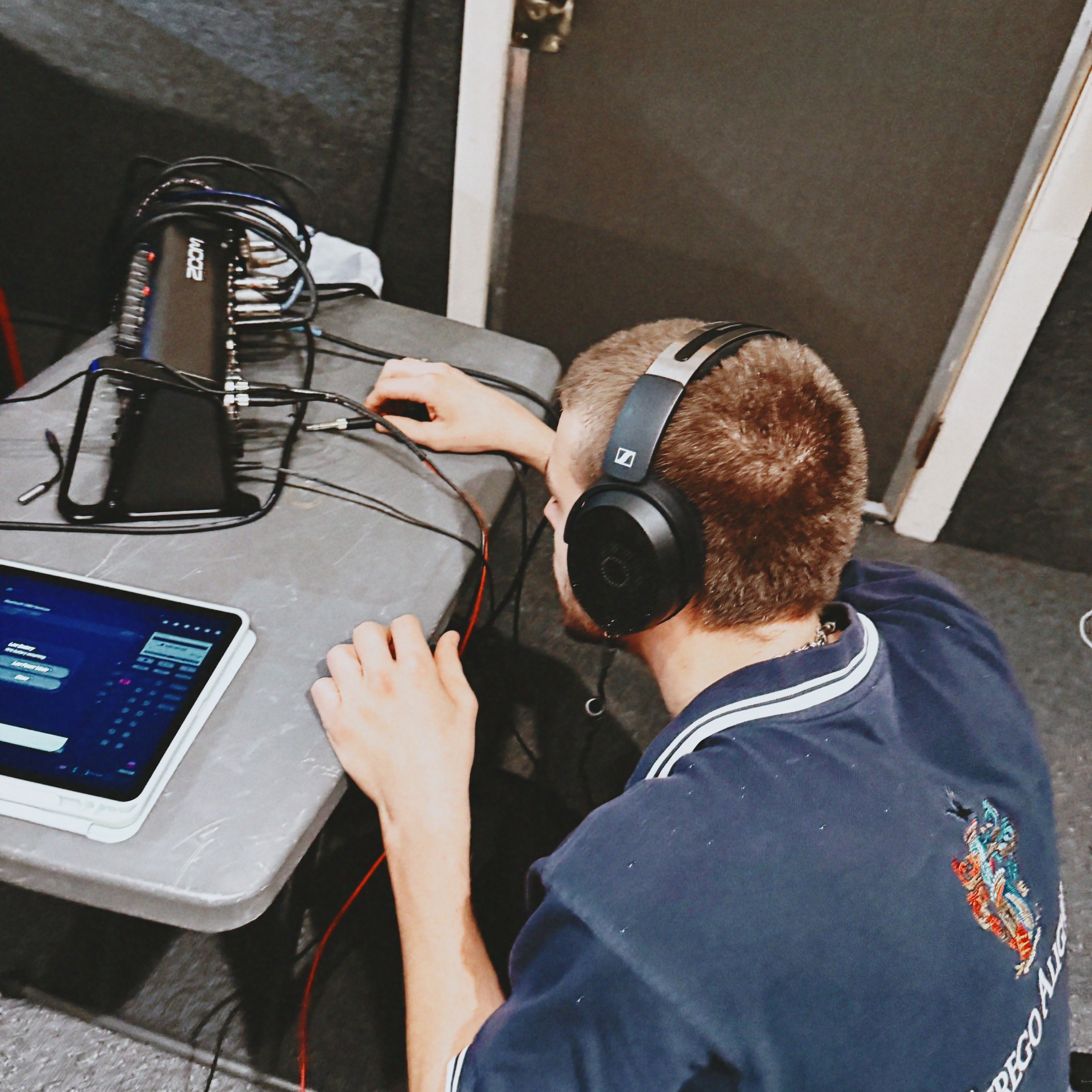 Adjusting recording equipment at Euphoria Studios